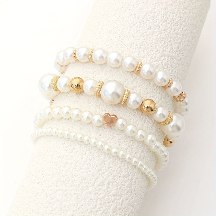 Set di bracciali con perle e cuore