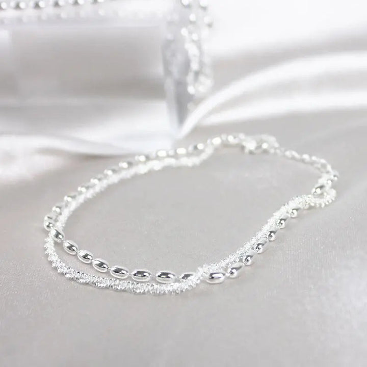 Set di bracciali argentati con zirconia