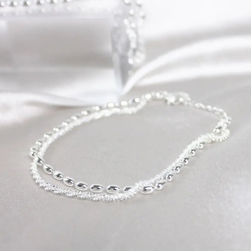 Set di bracciali argentati con zirconia