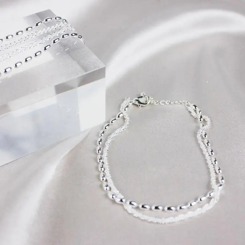 Set di bracciali argentati con zirconia