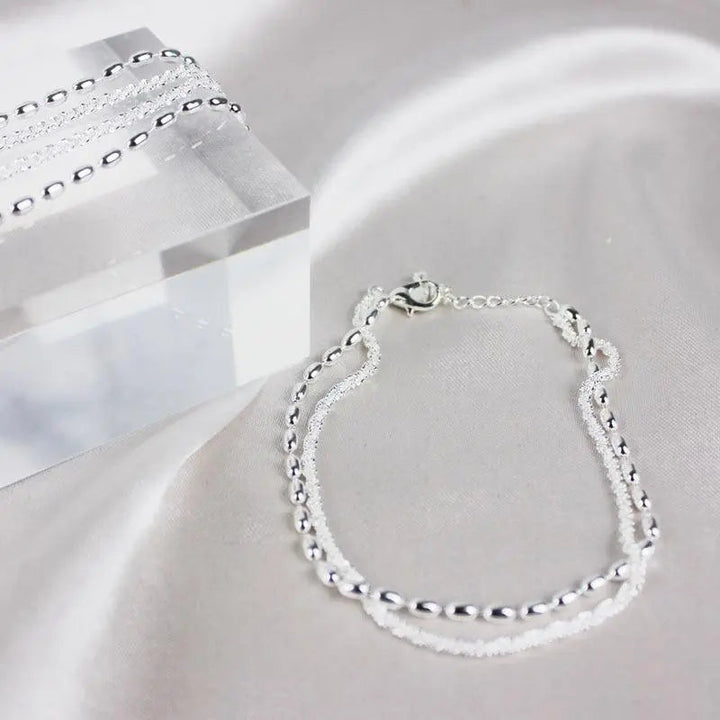 Set di bracciali argentati con zirconia