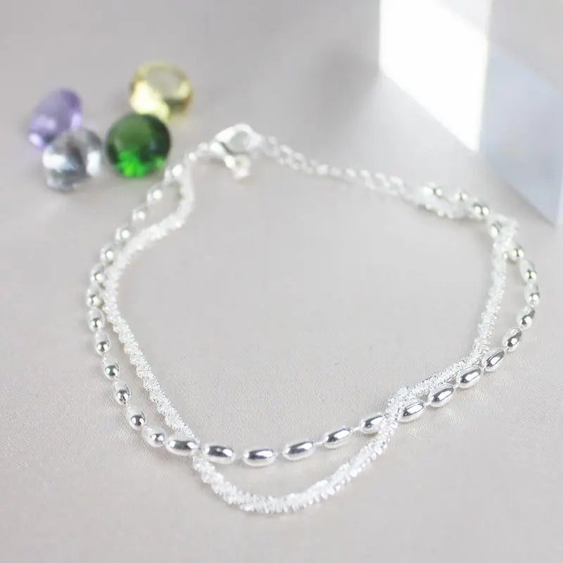 Set di bracciali argentati con zirconia