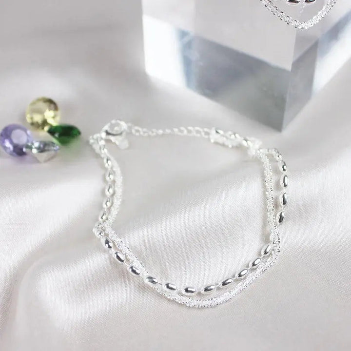 Set di bracciali argentati con zirconia