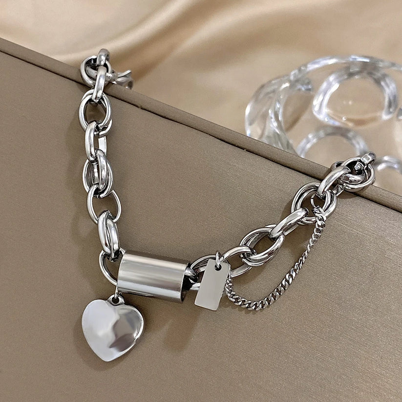 Bracciale dorato a maglie grandi con cuore